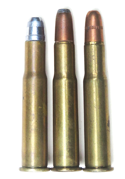 Three 32 Winchester Special cartridges, a handload on the left with a 32-40 bullet.